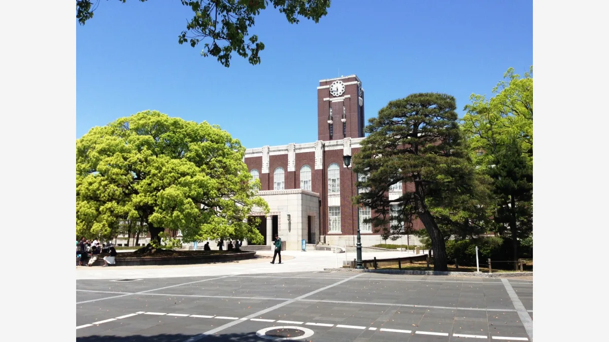 The clock tower at Kyoto University; Artificial Analysis timed Claude Opus 5.5's max-effort configuration at 682.71 seconds before its first token.