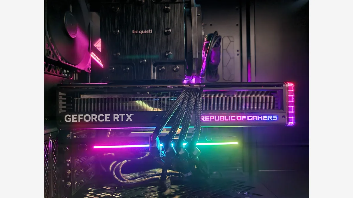 A consumer desktop graphics card installed in a PC case — the class of hardware Tim Dettmers says his lab's inference framework targets for 125-billion-parameter models.