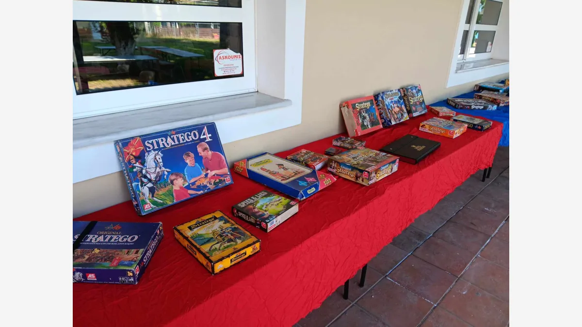 Stratego sets on display at a tournament — the hidden-information board game that resisted AI until the Ataraxos agent went superhuman on 16 GPUs.