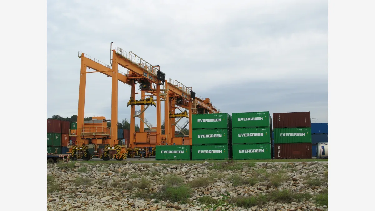 Container gantries at Kuantan Port in Malaysia — prosecutors say export-controlled Nvidia servers were routed through Malaysian and Singaporean intermediaries before reaching China.
