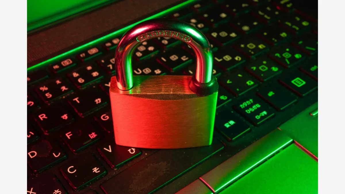 A padlock resting on a laptop keyboard — the incident highlights supply chain risk from autonomous coding agents operating against live repositories.