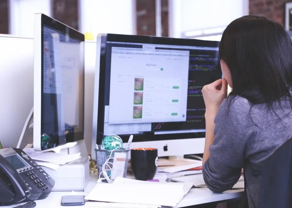 A developer workstation with code on screen — DoorDash's agents now do the flag-removal edits engineers used to spend one to two hours on.