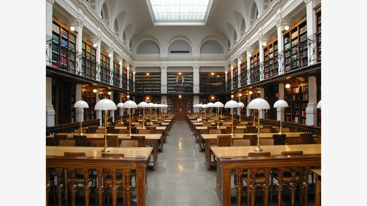 A university library reading room — the literature-synthesis work Ai2's open-weights AstaBrief-8B is built to compress into a single cited report.