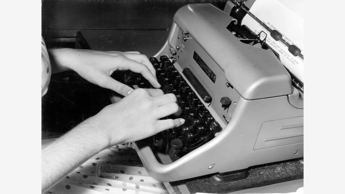 A typing-posture instruction photograph, used here to illustrate Graphite's measurement of the writing habits that separate frontier AI models from human authors.