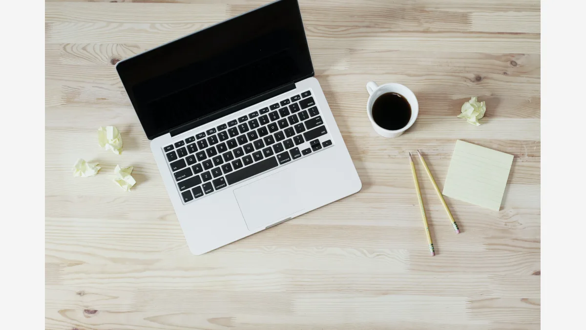 A laptop on a desk: macOS Full Disk Access grants an approved app the whole machine at once, which Apple now says is too blunt for AI agents.