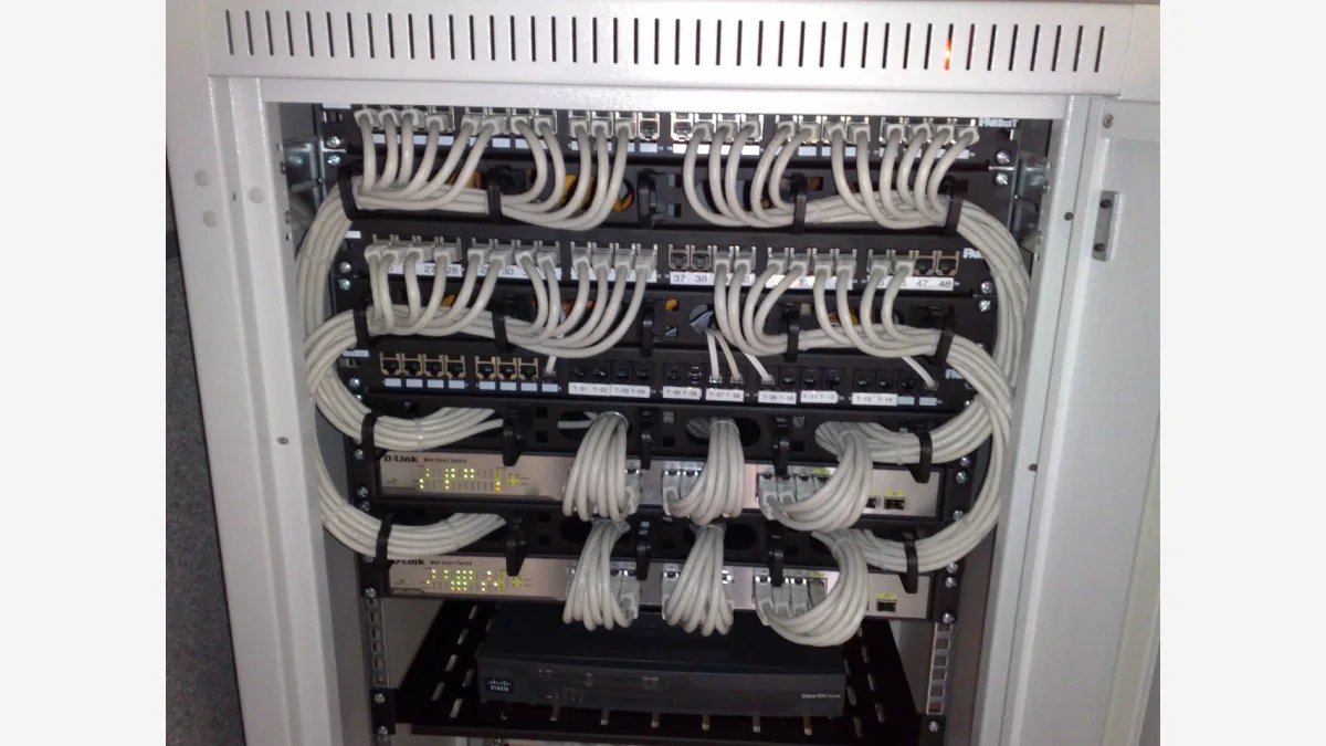 Rackmount Ethernet switches and patch panels: Cloudflare's Monetization Gateway moves payment into the HTTP request itself, settling before a resource is released. (Image: Wikimedia Commons)